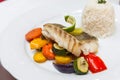 Fried cod with roasted vegetables. Royalty Free Stock Photo