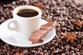 Fried coffee beans with a cup of coffee and espresso milk and anise