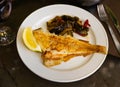 Fried common sole with lemon and baked vegetables Royalty Free Stock Photo