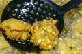 Fried cook of Batate Vade, Batate Vadey, Fried Dhal Beans Cake or Kuih Vadey closeup. Indian traditional food