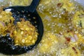 Fried cook of Batate Vade, Batate Vadey, Fried Dhal Beans Cake or Kuih Vadey closeup. Indian traditional food