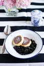 Fried Cottage Cheese cakes with flambe blueberries and teacup