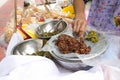 Local seller make fried rice crisp with sweet chili paste at Phra Athit road, Bangkok, Thailand