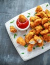 Fried crispy chicken nuggets with ketchup on white board Royalty Free Stock Photo