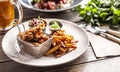 Fried crispy chicken wings with chips, dip and salad served on a table Royalty Free Stock Photo