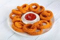 Fried crispy onion rings on plate Royalty Free Stock Photo