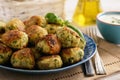 Fried crispy zucchini balls with feta cheese- vegetarian food.