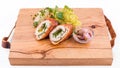 Fried cutlet cut in half, mashed potatoes, sauerkraut and pickled mushrooms on a wooden board Royalty Free Stock Photo