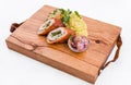 Fried cutlet cut in half, mashed potatoes, sauerkraut and pickled mushrooms on a wooden board Royalty Free Stock Photo