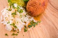 Fried cutlet, mashed potatoes, sauerkraut and pickled mushrooms on a wooden board Royalty Free Stock Photo