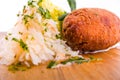 Fried cutlet, mashed potatoes, sauerkraut and pickled mushrooms on a wooden board Royalty Free Stock Photo