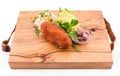 Fried cutlet, mashed potatoes, sauerkraut and pickled mushrooms on a wooden board on a white background Royalty Free Stock Photo