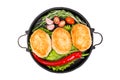 Fried cutlets with vegetables, herbs and spices in a frying pan Royalty Free Stock Photo