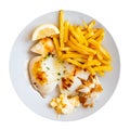 Fried cuttlefish drizzled with white garlic and parsley sauce,lemon wedge and french fries on plate