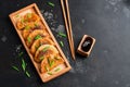 Fried dumplings. Asian snack Gyoza with soy sauce and green onions