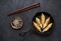 Fried dumplings Gyoza in a frying pan with soy sauce Royalty Free Stock Photo