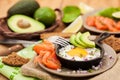 Fried egg, avocado and smoked salmon in frying pan Royalty Free Stock Photo