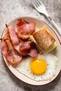 Fried egg, bacon and baguette with mozzarella cheese sandwich. Breakfast plate. Royalty Free Stock Photo