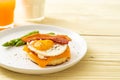 fried egg with bacon and cheese on pancake Royalty Free Stock Photo