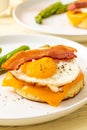 fried egg with bacon and cheese on pancake Royalty Free Stock Photo