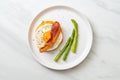 fried egg with bacon and cheese on pancake Royalty Free Stock Photo