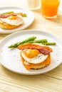 fried egg with bacon and cheese on pancake Royalty Free Stock Photo