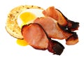 Fried Egg And Bacon Rashers On A large English Crumpet Royalty Free Stock Photo