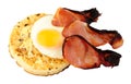 Fried Egg And Bacon Rashers On A large English Crumpet Royalty Free Stock Photo