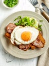 Fried egg, bacon and toasted bread Royalty Free Stock Photo