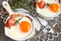 Fried egg with bacon and tomato in ceramic pan Royalty Free Stock Photo