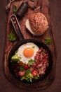fried egg, with bacon and vegetables, in a cast-iron frying pan, top view, homemade breakfast, Royalty Free Stock Photo