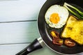 Fried egg and bread in the pan placed on the table Royalty Free Stock Photo