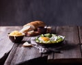 Fried egg and bread on wooden table Royalty Free Stock Photo