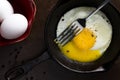 Rustic fried egg with broken yolk