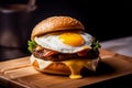 fried egg cheese burger with grilled meat on wooden tray Royalty Free Stock Photo