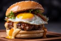 fried egg cheese burger with grilled meat on table Royalty Free Stock Photo