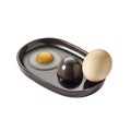 Fried Egg, Chocolate Sphere, and Whole Egg on a Dark Plate Royalty Free Stock Photo