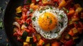 Fried egg on colorful vegetables in a pan. Royalty Free Stock Photo