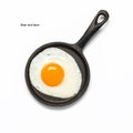 Fried egg in a frying pan isolated on a white background. Top view, flat lay Royalty Free Stock Photo