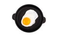 Fried egg on frying pan, top view. Isolated on white background. Royalty Free Stock Photo