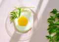 Fried egg with Green on glass plate. Creative idea. Breakfast time. Healthy lifestyle.