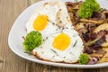 Fried Egg on a heap of roasted Potatoes Royalty Free Stock Photo