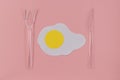 Fried egg with knife and fork. Royalty Free Stock Photo