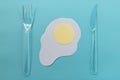 Fried egg with knife and fork. Royalty Free Stock Photo