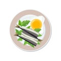Fried egg and little fish on a plate, isolated on a white background Royalty Free Stock Photo