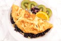 Fried egg omelet with blueberries, coffee cup Royalty Free Stock Photo