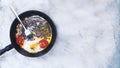 Fried egg pan. Breakfast with fried eggs and vegetables Royalty Free Stock Photo