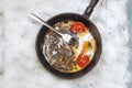 Fried egg pan. Breakfast with fried eggs and vegetables Royalty Free Stock Photo