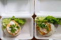 Fried egg put on white rice in foam box. Two box Royalty Free Stock Photo
