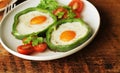 Fried egg in the ring of the bell peppers with herbs Royalty Free Stock Photo